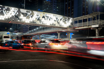Beautiful light trails with modern pedestrian bridge