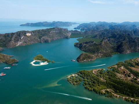 Aerial view of Kilim Geoforest Park. There is sea, river, coastline, mangroves and mountains on the photo. Langkawi, Malaysia.