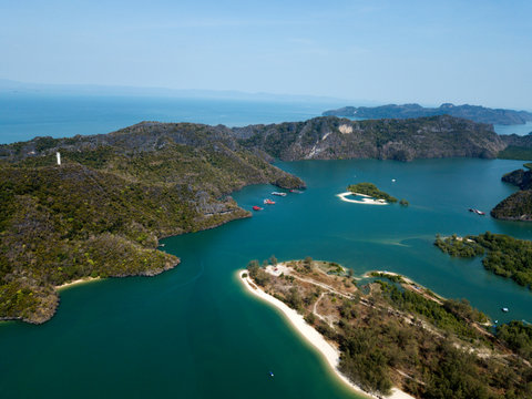 Aerial view of Kilim Geoforest Park. There is sea, river, coastline, mangroves and mountains on the photo. Langkawi, Malaysia.