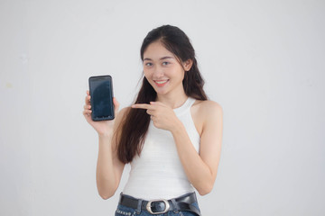 Naklejka premium Portrait of thai china adult beautiful girl White shirt blue jeans show her smart phone