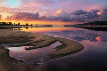 Fototapeta premium beauty sunset reflected in a calm water