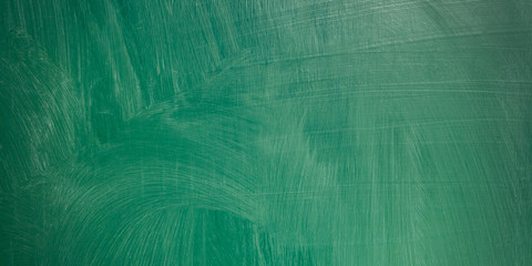 close up of an empty school green chalkboard panorama background.