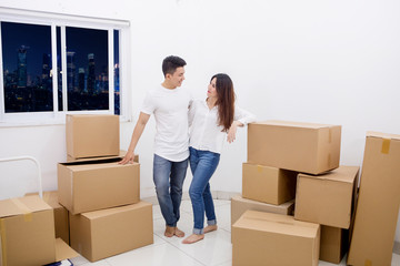 Romantic couple standing in a new apartment