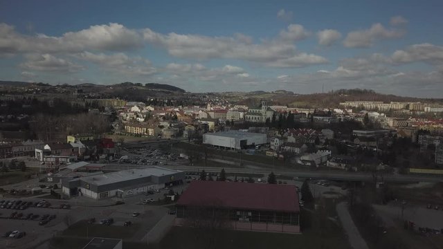 Gorlice, Poland - 3 9 2019: Panorama of the historic center of the European medieval city on the picturesque green hills. Trips to architectural monuments, temples, quarters and sports complex MOSiR