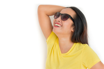 Naklejka premium Close up shot of stylish woman in sunglasses smiling on white background.