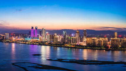 Fototapeta na wymiar cityscape and skyline of downtown near water of Hong Kong at night 