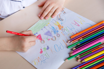 hands of the child draw a card happy birthday mom