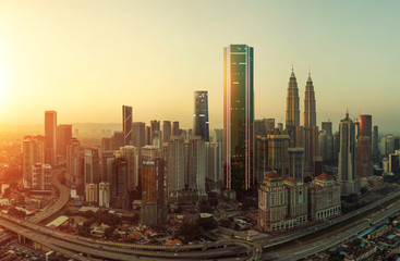 Future 3d modern neon light design skyscraper mix in sunrise Kuala Lumpur city skyline , future vision of modern city , mixed media .