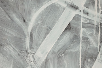 Blurred abstract background. The texture of the surface of the painted glass with white lines, stains and drips of paint from a rough brush. Cropped shot, horizontal, a great place for text. The conce