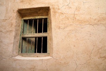 An old window in one of the ancient mud houses in the Sultanate of Oman
