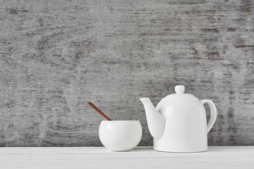 teapot and sugar bowl on gray background