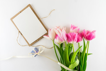 Fototapeta premium Pink and white bouquet of tulips on white background.
