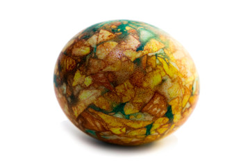 one yellow-green marbled egg isolated on white background