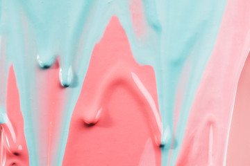 Blue paint covering pink paint. Bright colored shot. abstract .