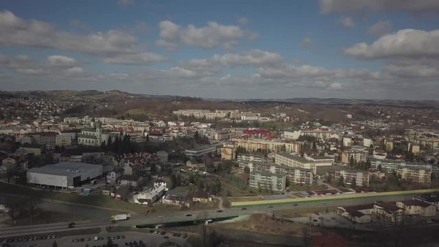 Gorlice, Poland - 3 9 2019: Panorama of the historic center of the European medieval city on the picturesque green hills. Trips to architectural monuments, temples, quarters and sports complex MOSiR
