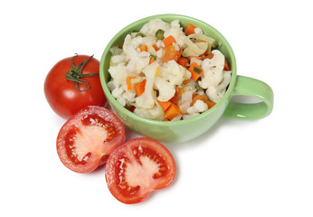 Porcelain plate with vegetable soup on white background