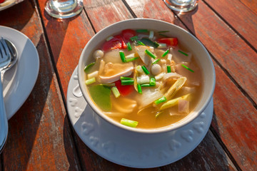 Hot and spicy soup with pork Thailand food recipe boiled pork with tomato and vegetables.