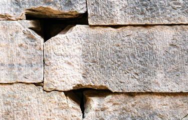 temples stone wall texture background with irregularities