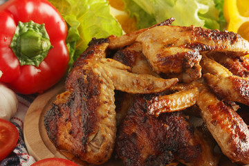 Chicken wings barbecue with different vegetables