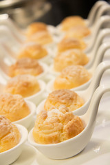  delicious vanilla eclair on white spoon