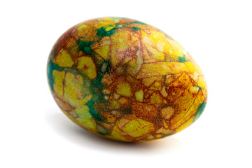 one yellow-green marbled egg isolated on white background