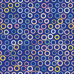 Seamless vector background with multicolored circles. Geometric pattern.