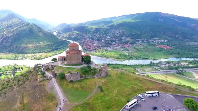 Old georgian Svetitskhoveli Cathedral In Mtskheta with sky and green hills