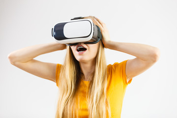 Girl wearing virtual reality goggles.