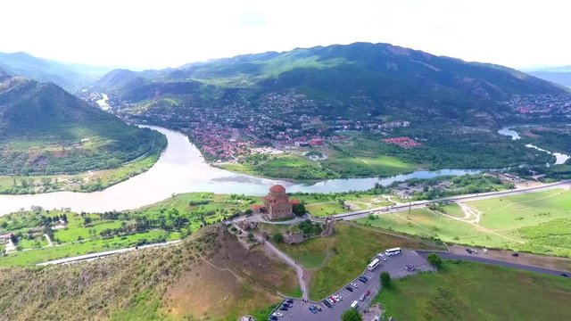 Old georgian Svetitskhoveli Cathedral In Mtskheta with sky and green hills