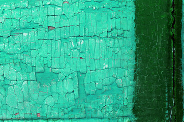 Old wooden background with remains of pieces of scraps of old paint on wood. Texture of an old tree, vintage wood background peeling paint. old blue board with cracked paint