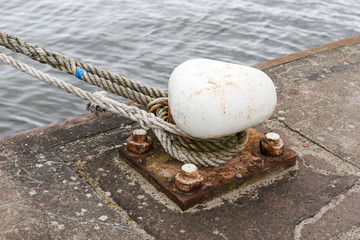 Fototapeta premium Ship mooring rope moored on the bollard