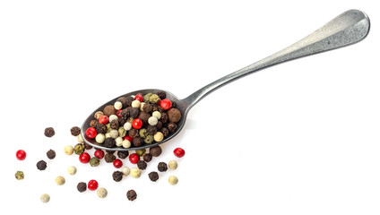 Pepper mix. Different peppercorns in spoon isolated on white background
