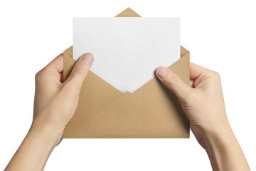 Fototapeta premium Hand holding an open brown envelope with a blank paper inside, isolated on white background