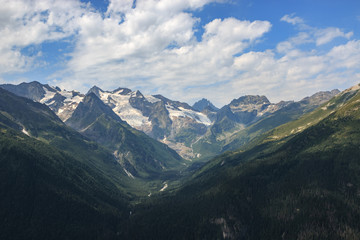 Panorama of mountains scene with dramatic blue sky in national park of Dombay