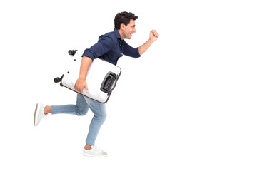 Handsome Caucasian tourist running fast and holding luggage on white background, Vacation travel concept