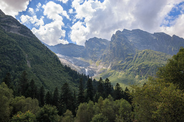 Fototapeta na wymiar Panorama view on mountains scene and away waterfall in national park of Dombay