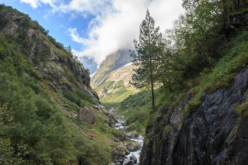 Fototapeta na wymiar Panorama view of mountains scene in national park of Dombay, Caucasus, Russia