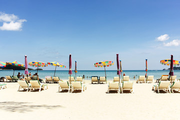 Seascape, picture of beach chairs and beach umbrellas (booth up color process)