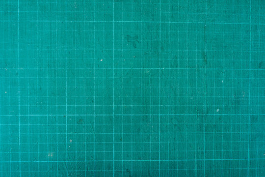 Premium Photo  Green cutting mat on wood texture background.