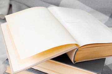 Stack of old vintage books on wooden shelf in  university library