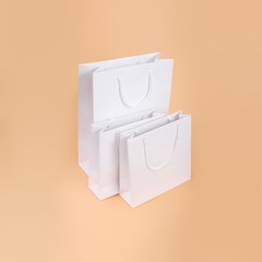 White paper bags isolated on simple background