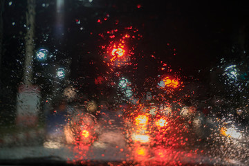 Fototapeta na wymiar Rain drops on window car