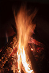 Close up shot of burning firewood in the fireplace