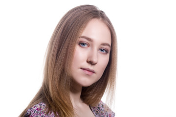 Naklejka premium Portrait of a young woman with blond hair on a white background.
