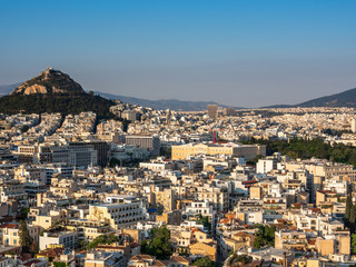 View of Athens, Greece and mount of Lycabettus from Acropolis at sunset
