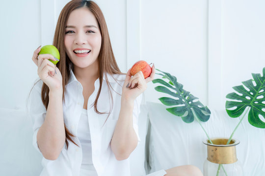 beautiful asian attractive woman hand hold apple healthy eat ideas concept portrait of asian long hair woman