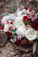 Wedding beautiful bouquet on dark stone background