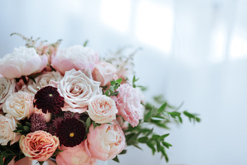 Wedding flowers, bridal bouquet closeup. Decoration made of roses, peonies and decorative plants, close-up, selective focus, nobody, objects