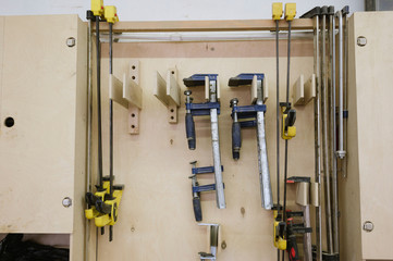 Tools hang on the wall in the carpentry workshop