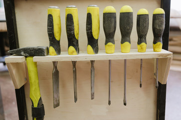 A set of screwdrivers hanging in the workshop